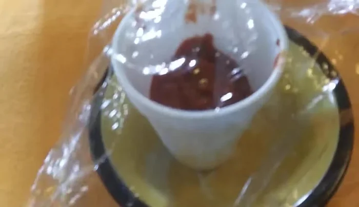 Secure the plastic wrap with a rubber band.