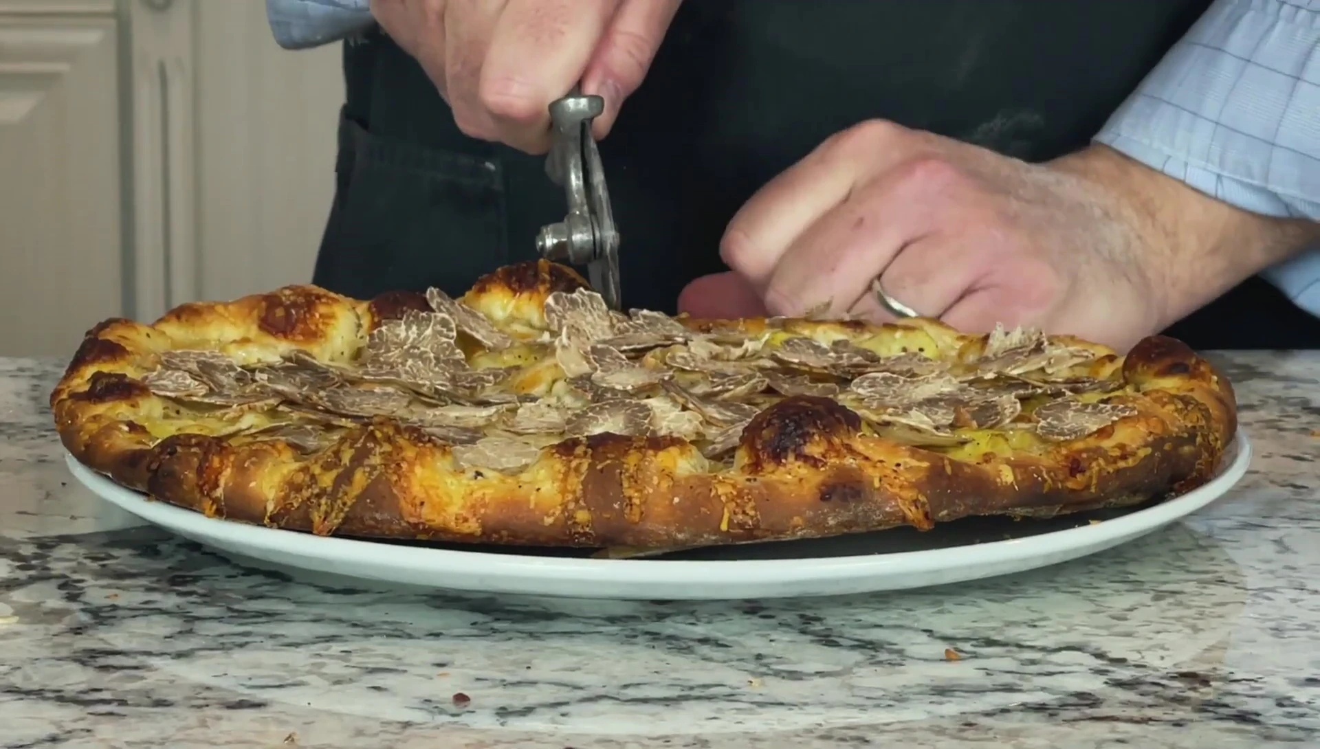 A close-up shot of the finished pizza, showcasing its texture and toppings.