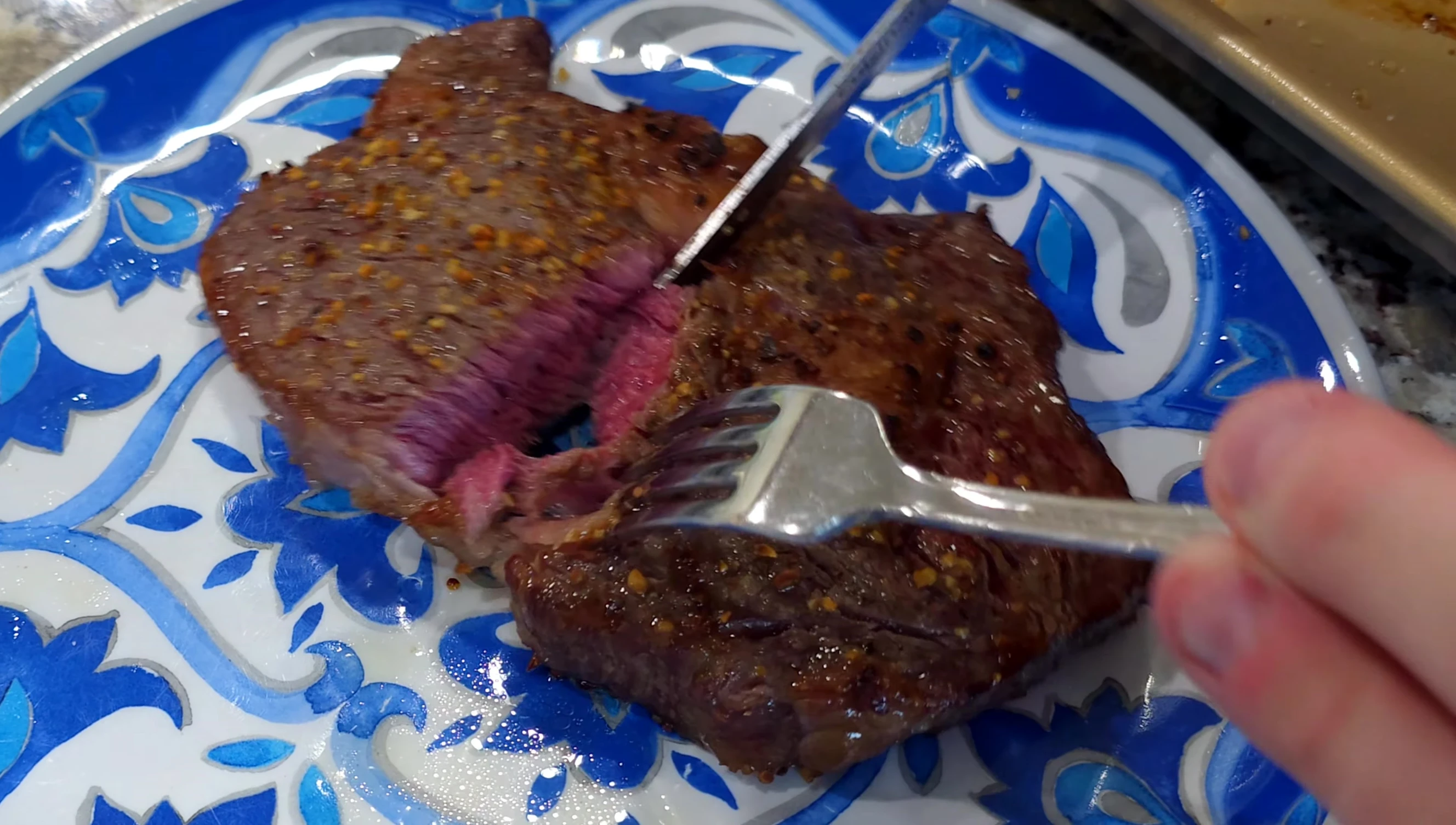 Close-up of the cooked Wagyu steak, showcasing its texture and doneness.