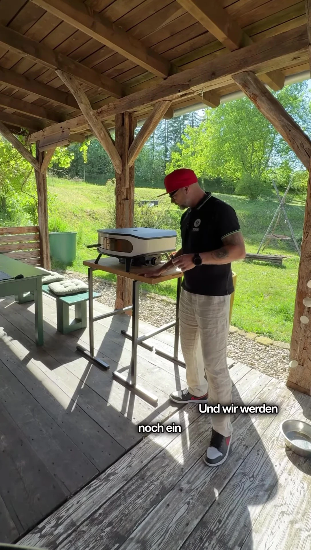 Speaker discussing future plans for an outdoor oven setup.