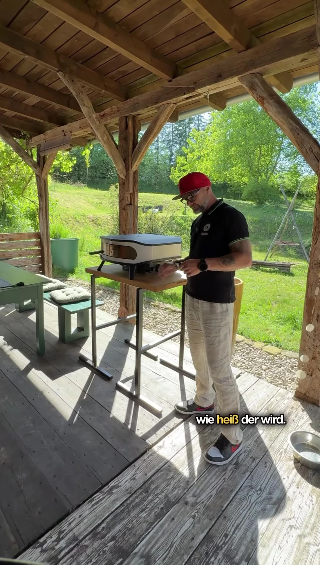The speaker using an infrared thermometer to check the oven's temperature.