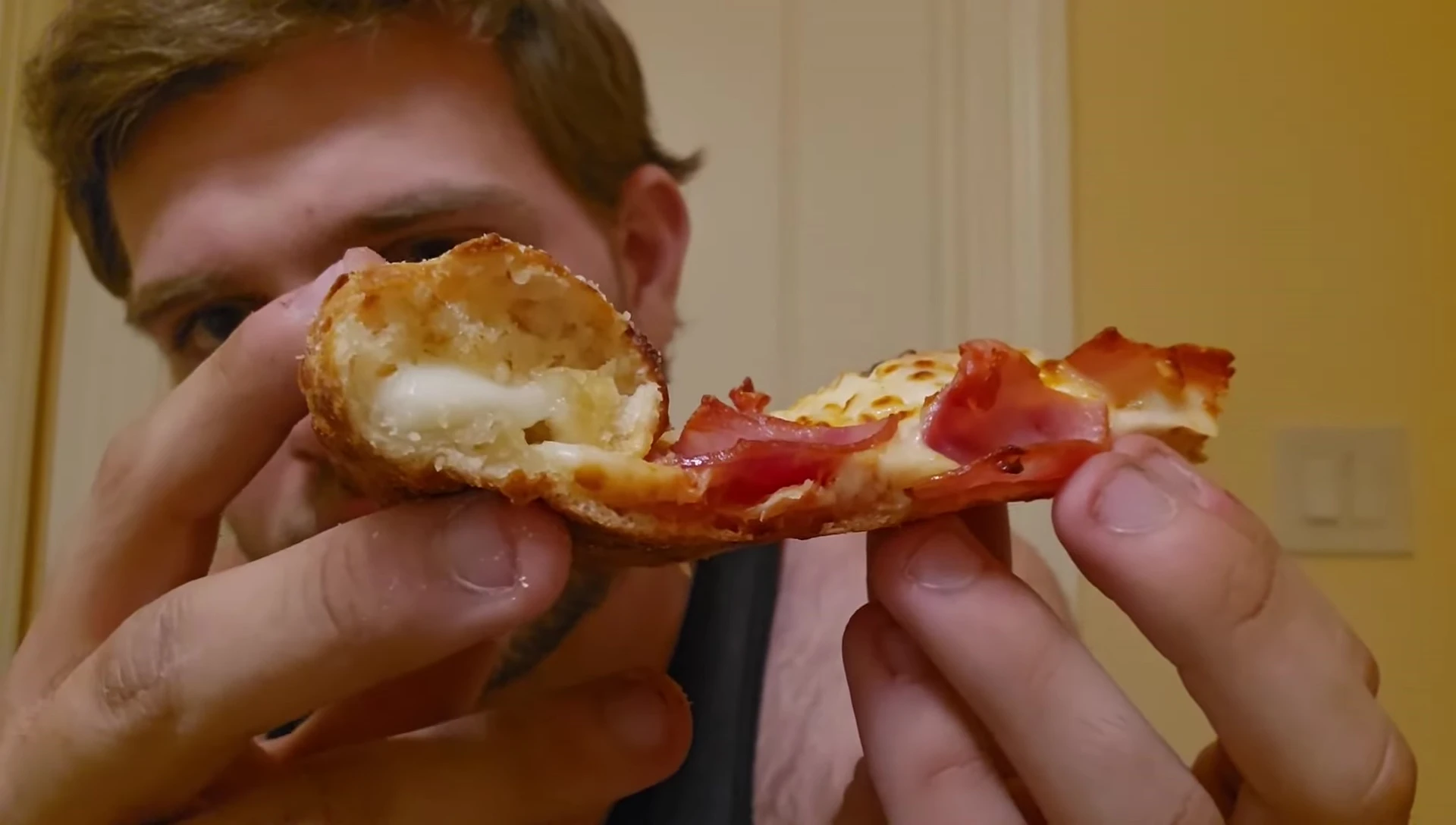 A slice of pizza showing the stuffed crust