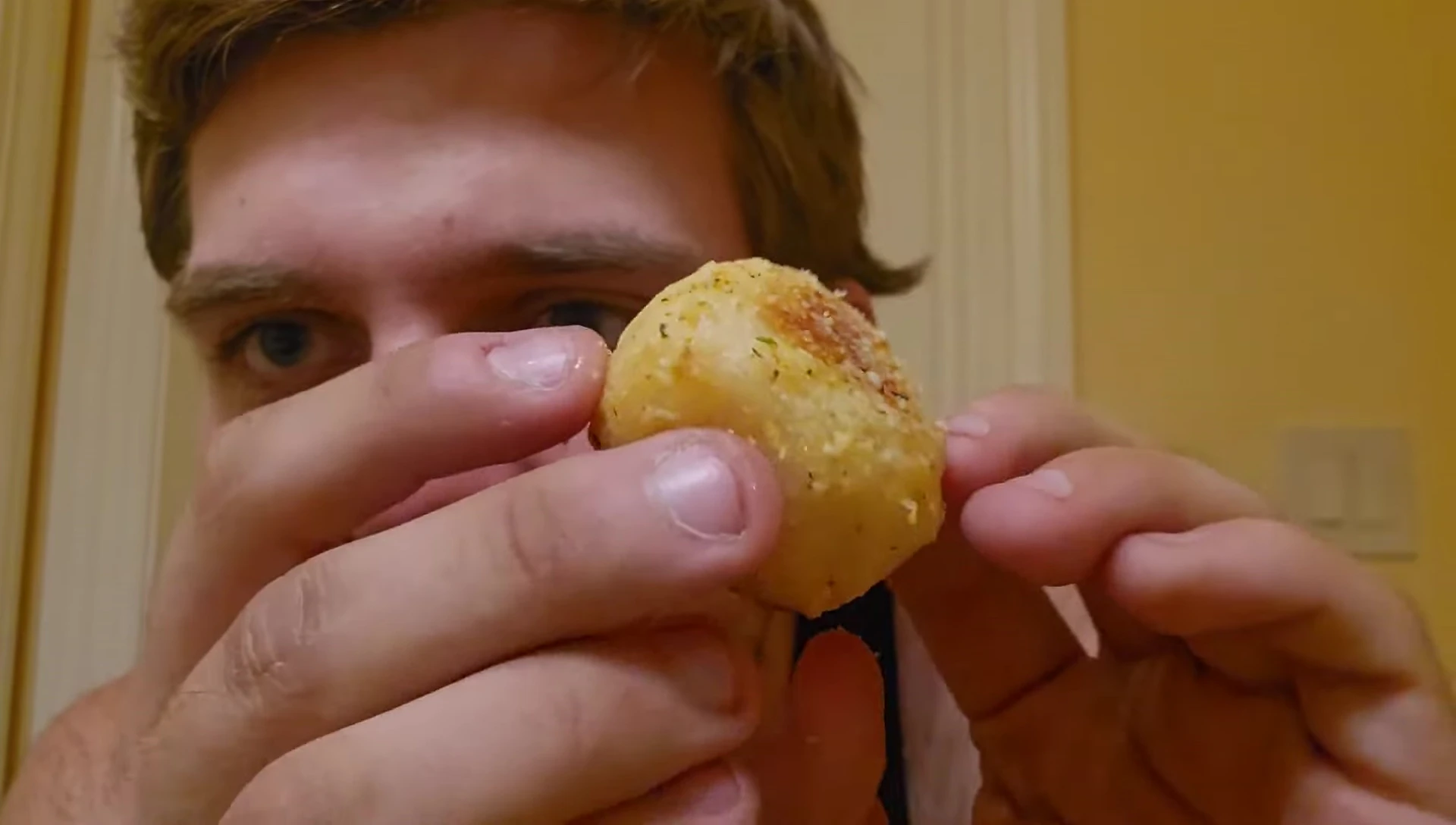 Reviewer eating a bread bite