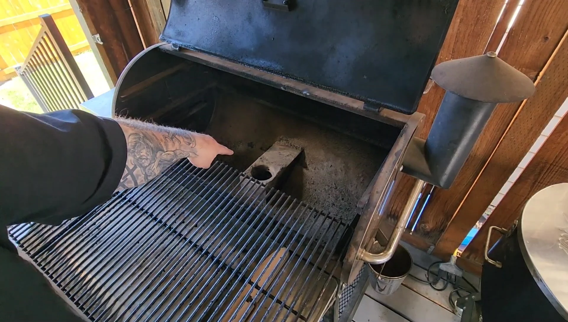 Removing the firepot cover and drip pan from the Recteq pizza oven