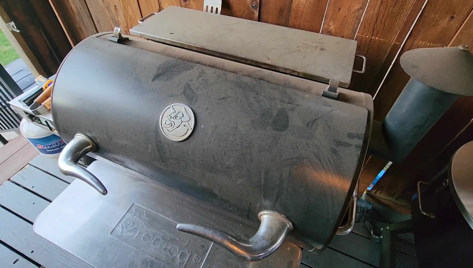Placing the pizza into the Recteq oven