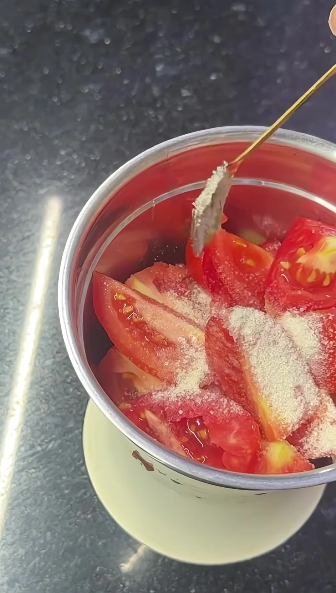 Adding sugar and salt to the tomatoes