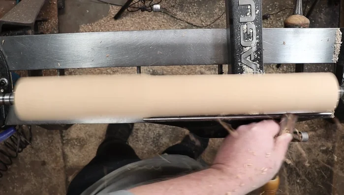 Check roundness with your hand and refine the dowel until perfectly round, using calipers to ensure consistency.