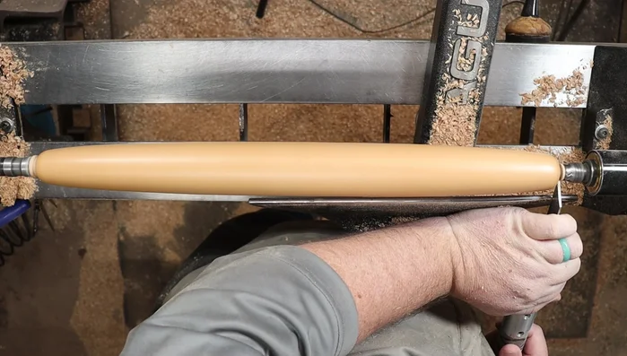 Use a parting tool to carefully score the tenons before removing them with a saw. Sand the ends smooth.