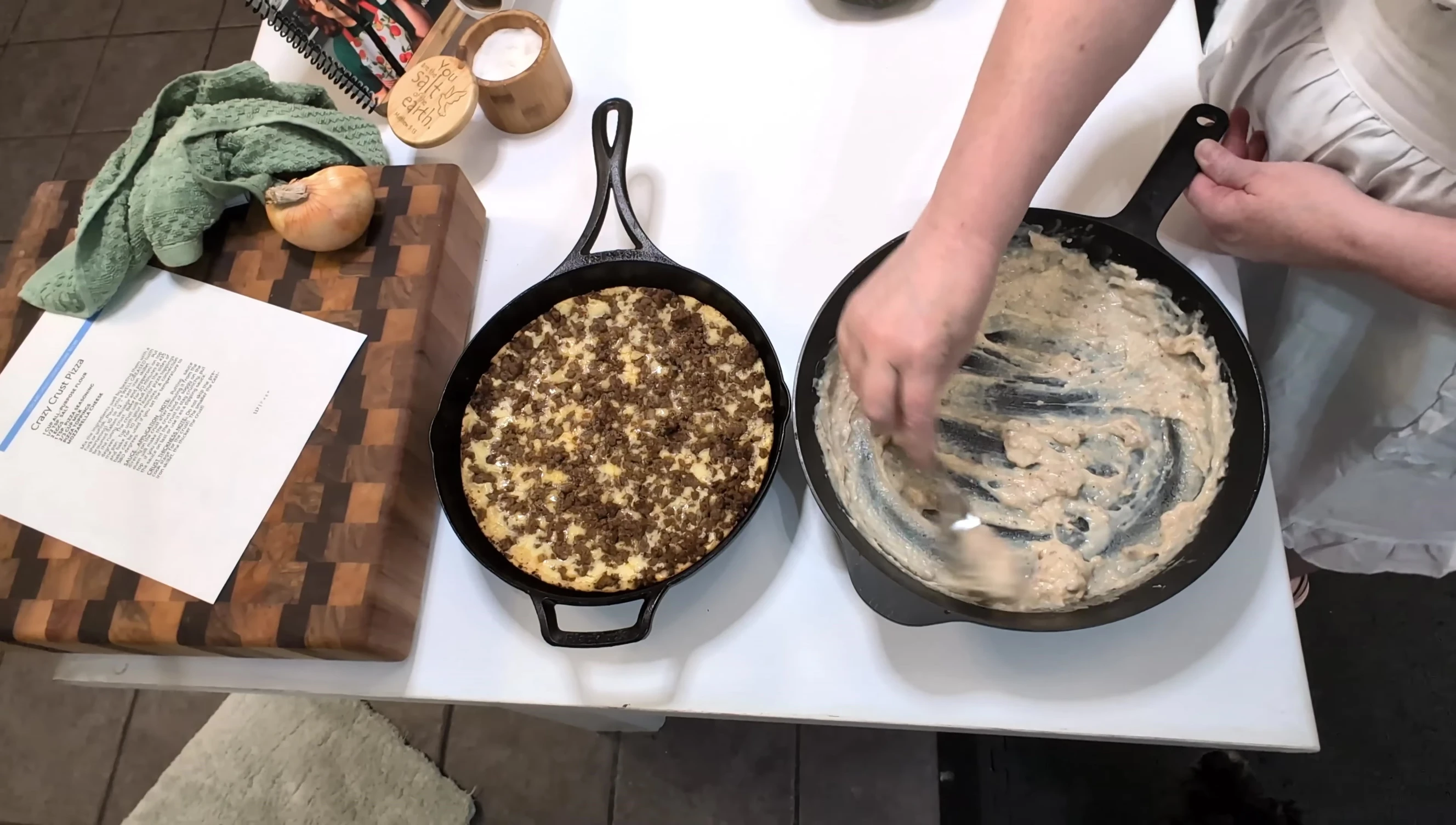 Adding gravy to the pizza