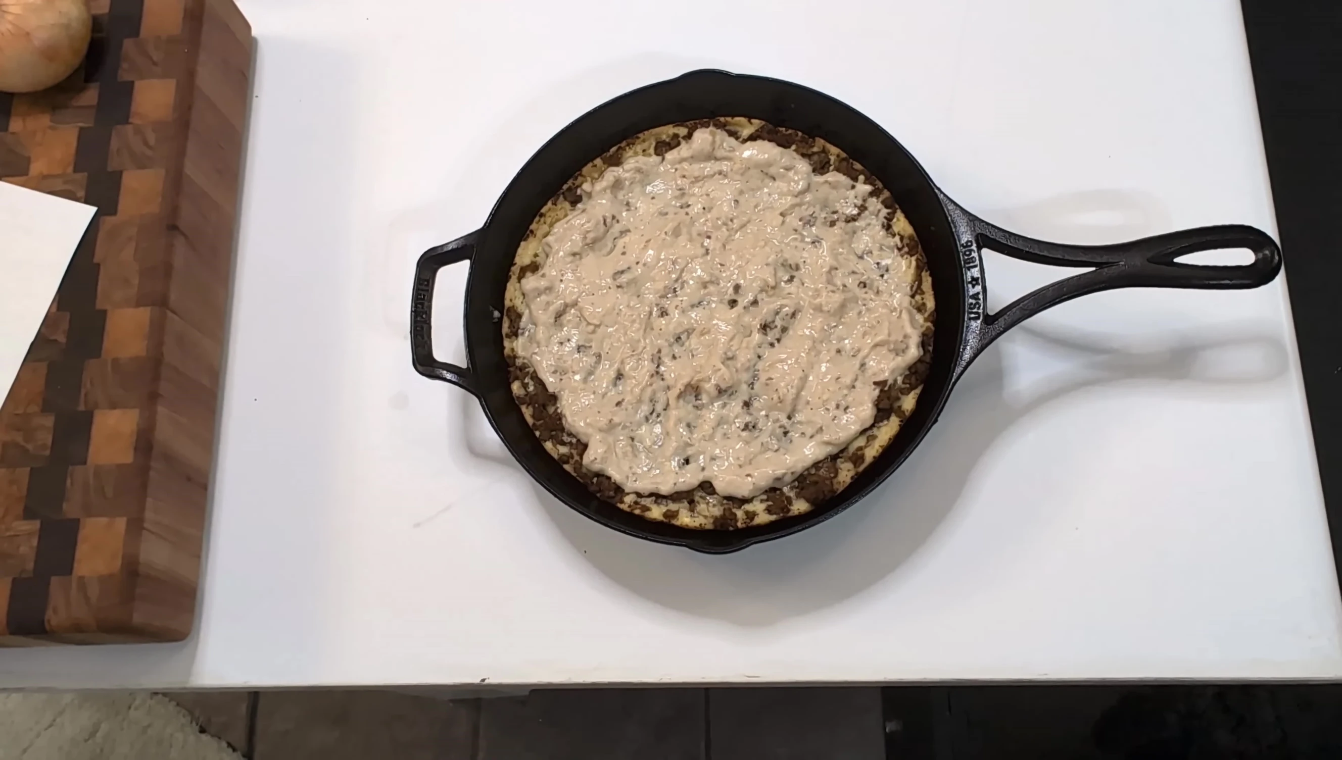 Adding eggs to the pizza