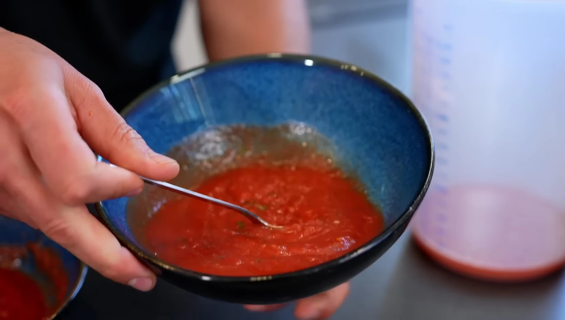 The separated water from the sauce after straining