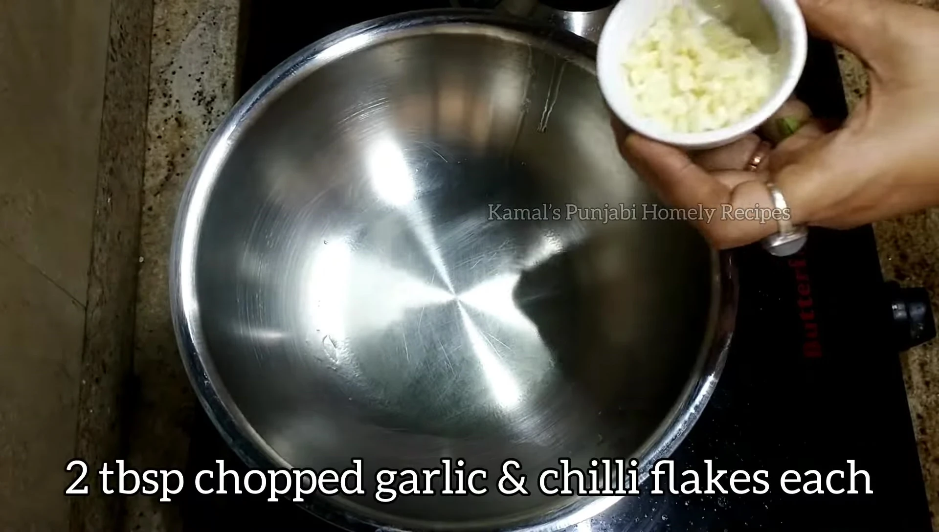 Sautéing garlic and chili flakes for the herb rice.