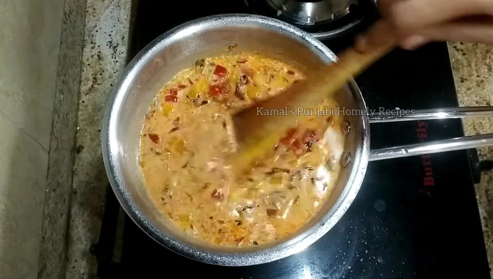 Adding cheese to the pizza gravy.