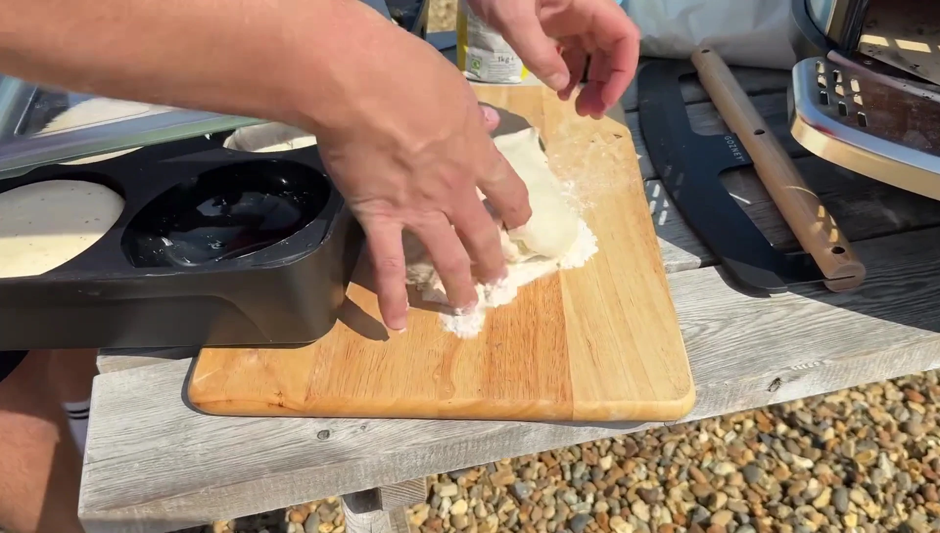 Preparing the pizza dough.