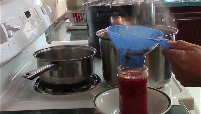 Fill the jars: Fill hot jars with the pizza sauce, leaving ½ inch headspace. Wipe the rims clean.