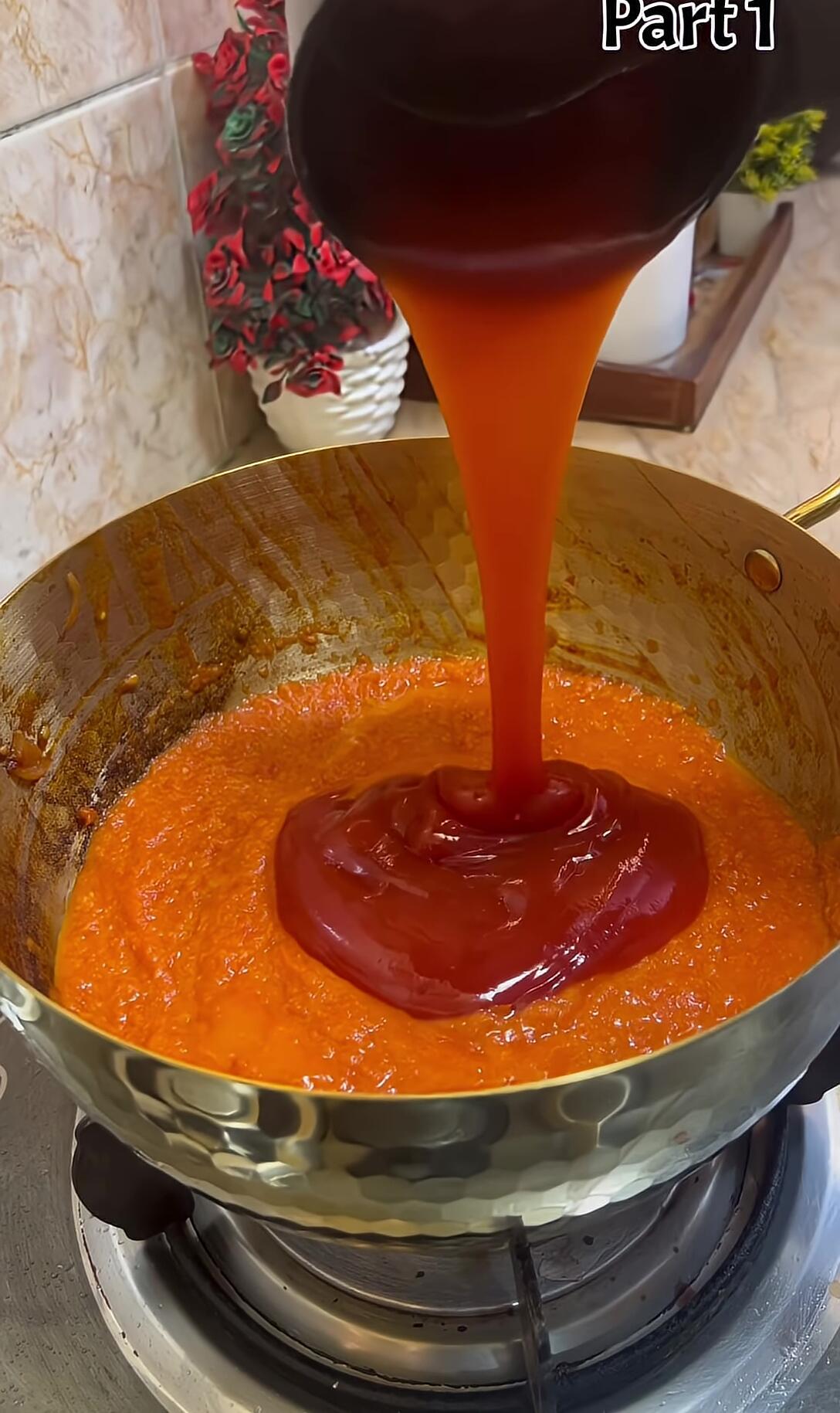 Adding tomato ketchup and spices to the tomato puree.