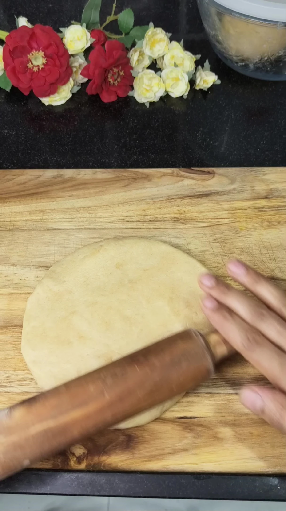Shaping the pizza dough.