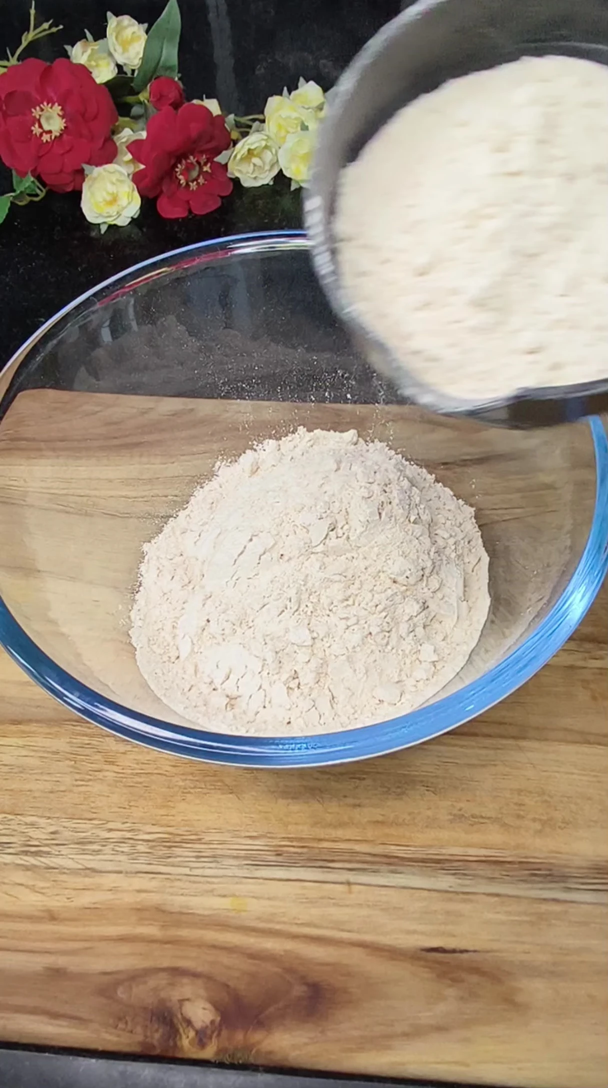 Measuring whole wheat flour for the pizza dough.