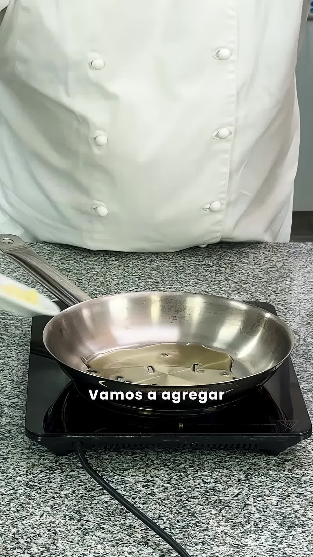 Adding garlic and ground chili to the pan