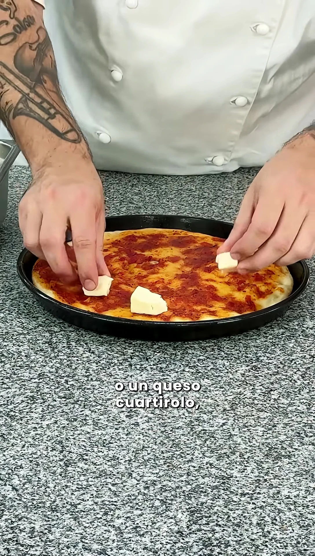 Adding cheese to the pizza