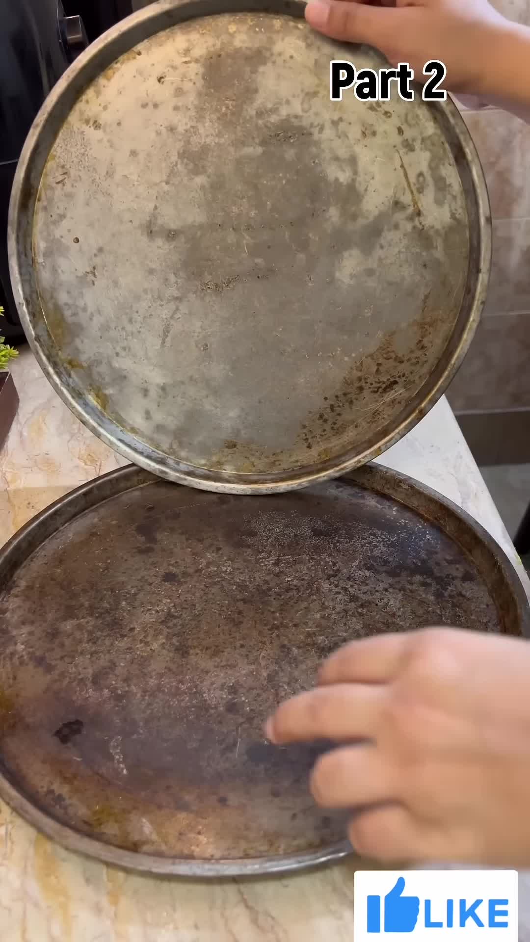 Close-up of a damaged, rusty pizza pan.