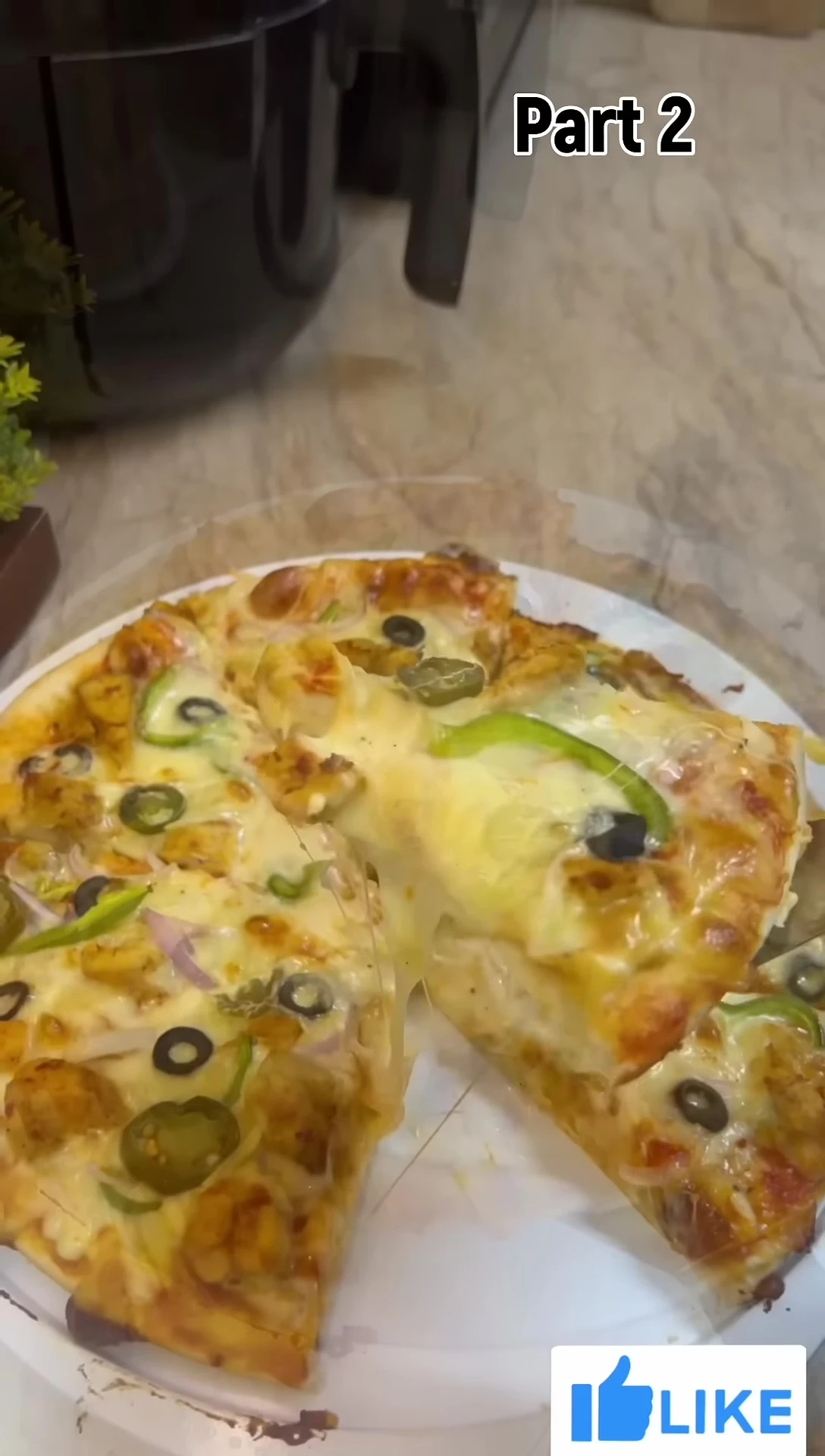 The finished, cheesy pizza.