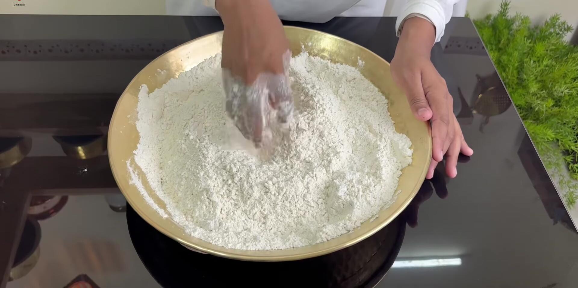 Adding water to the dough and starting to knead.