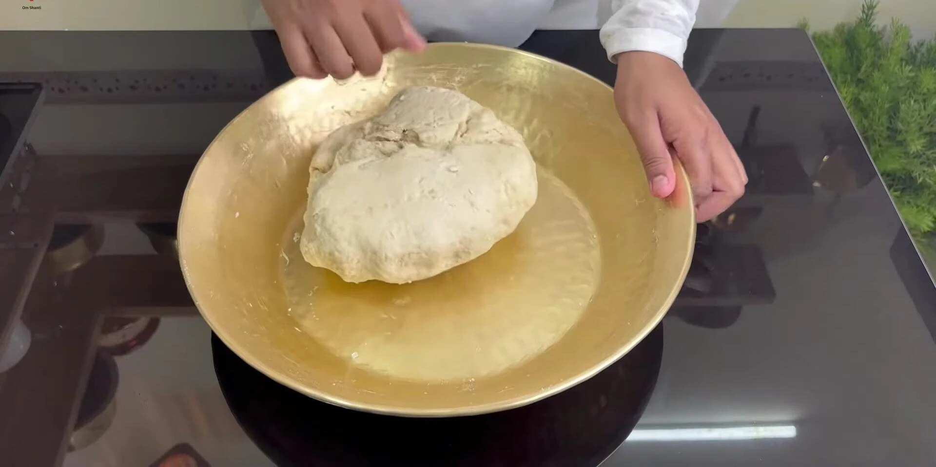 Kneading the dough vigorously.
