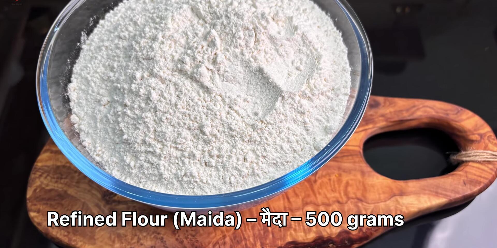 Ingredients for the pizza dough laid out on a table.