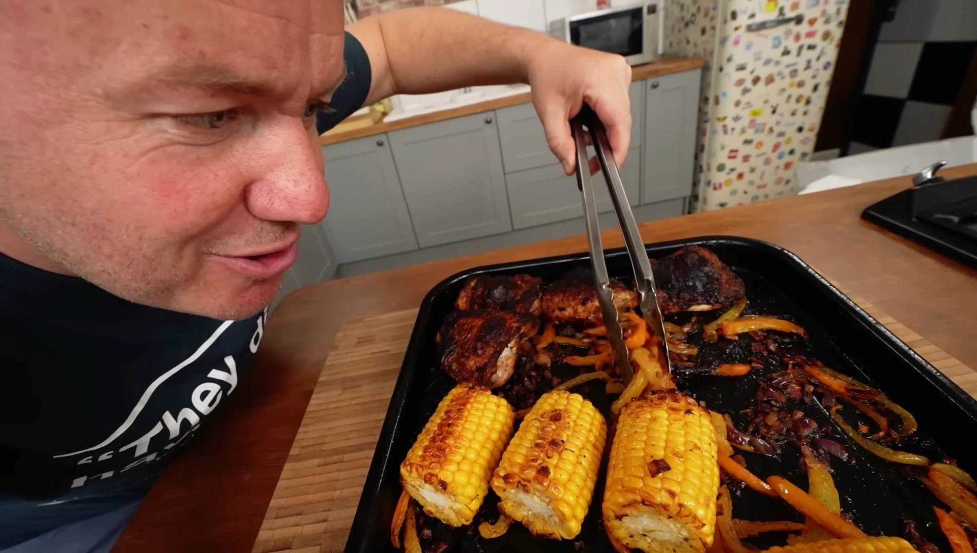 Finished Cajun chicken tray bake, showcasing the charred vegetables and chicken