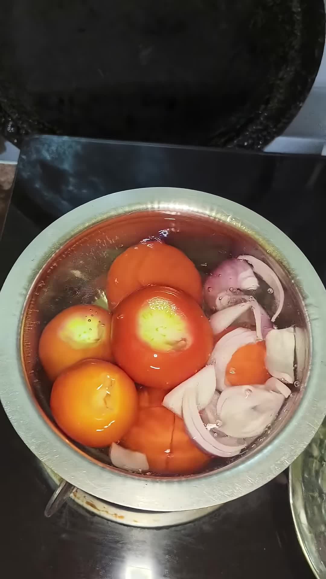 Close-up shot of the pizza sauce being prepared.