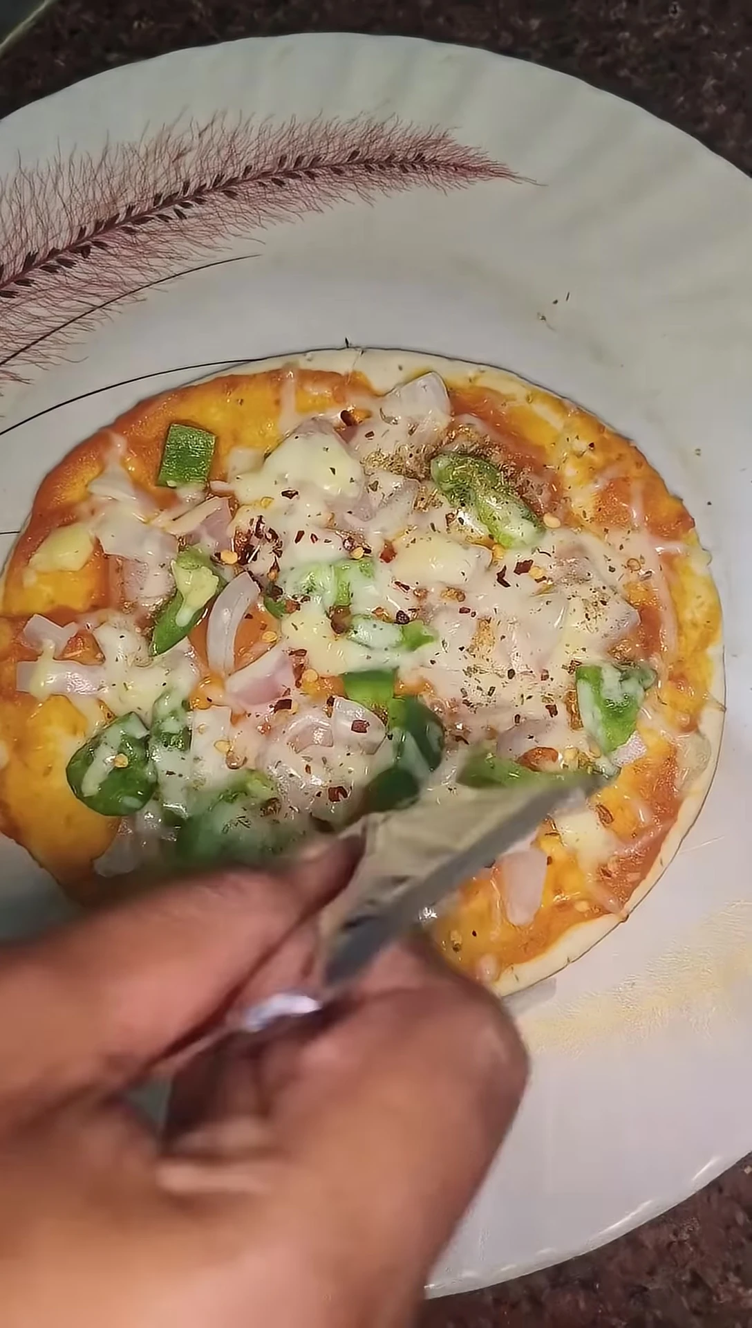 A shot showing the pizza being enjoyed.