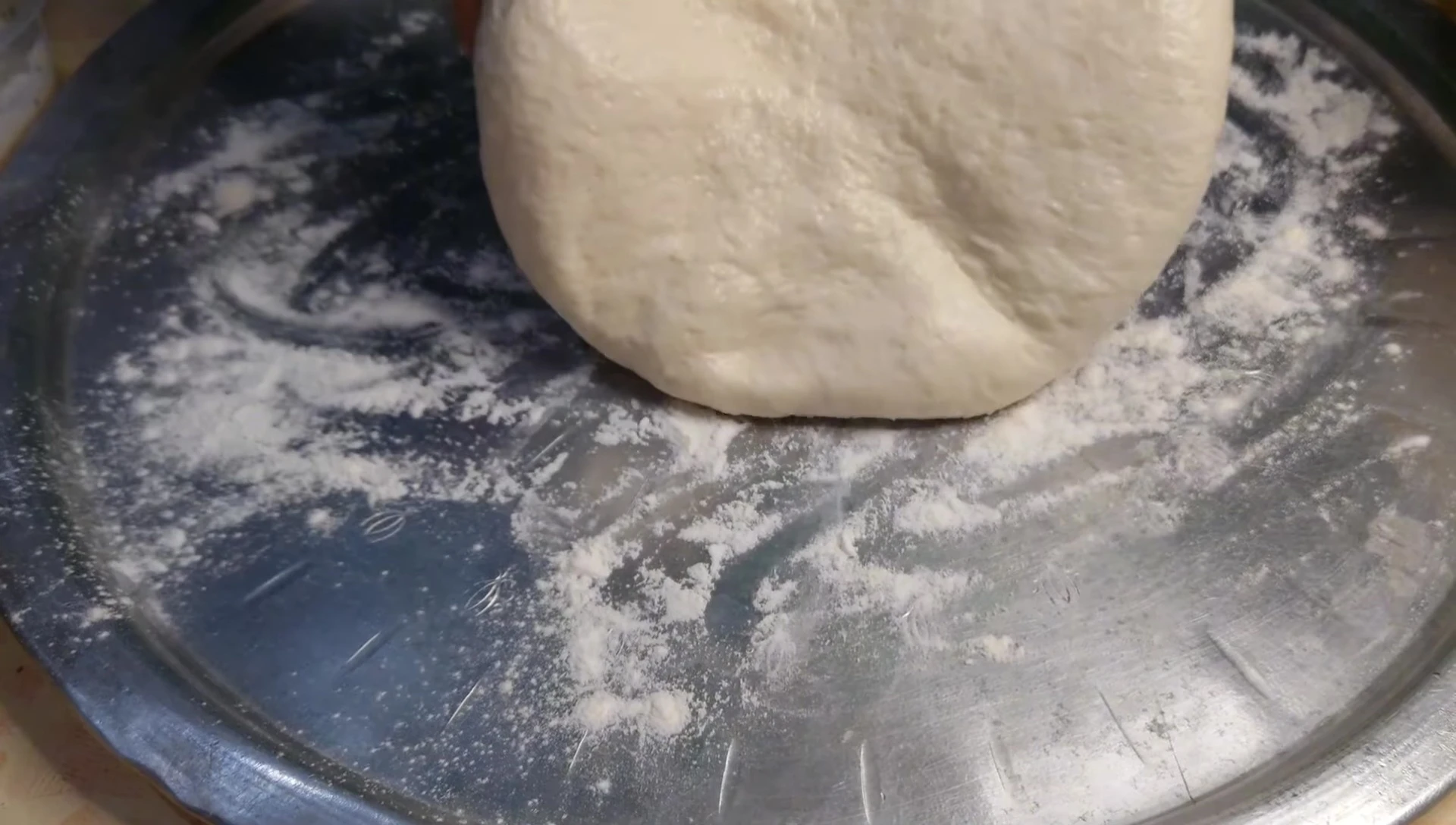 Shaping the pizza dough