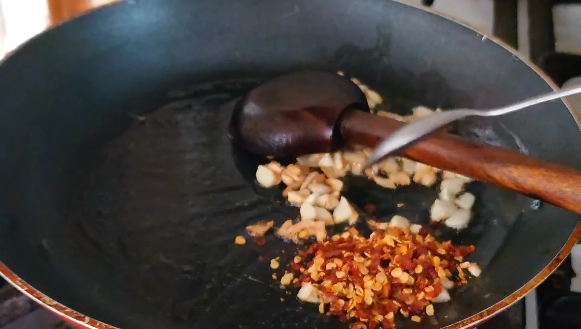 Adding spices to the tomato sauce