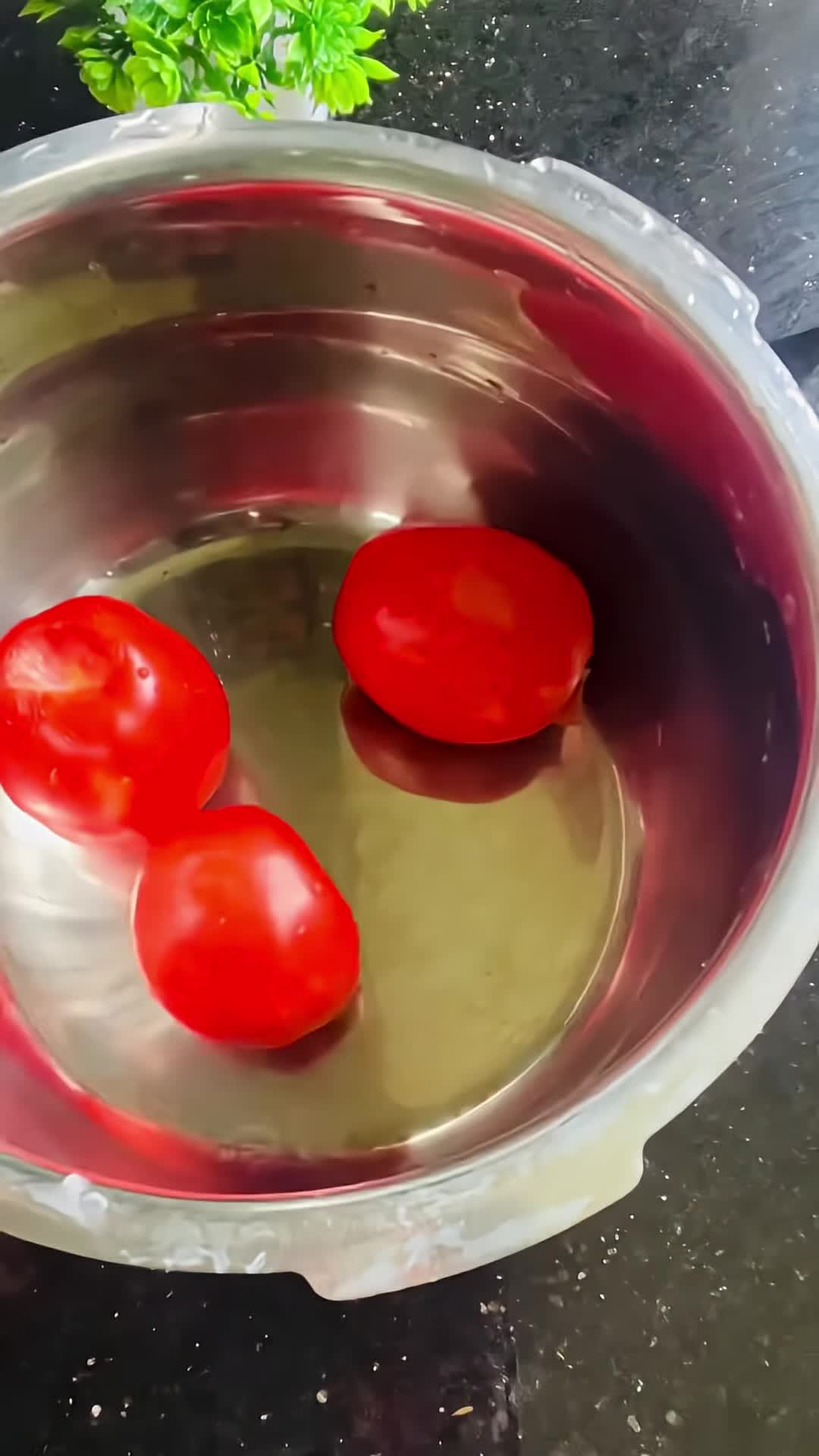 Person blanching and chopping tomatoes