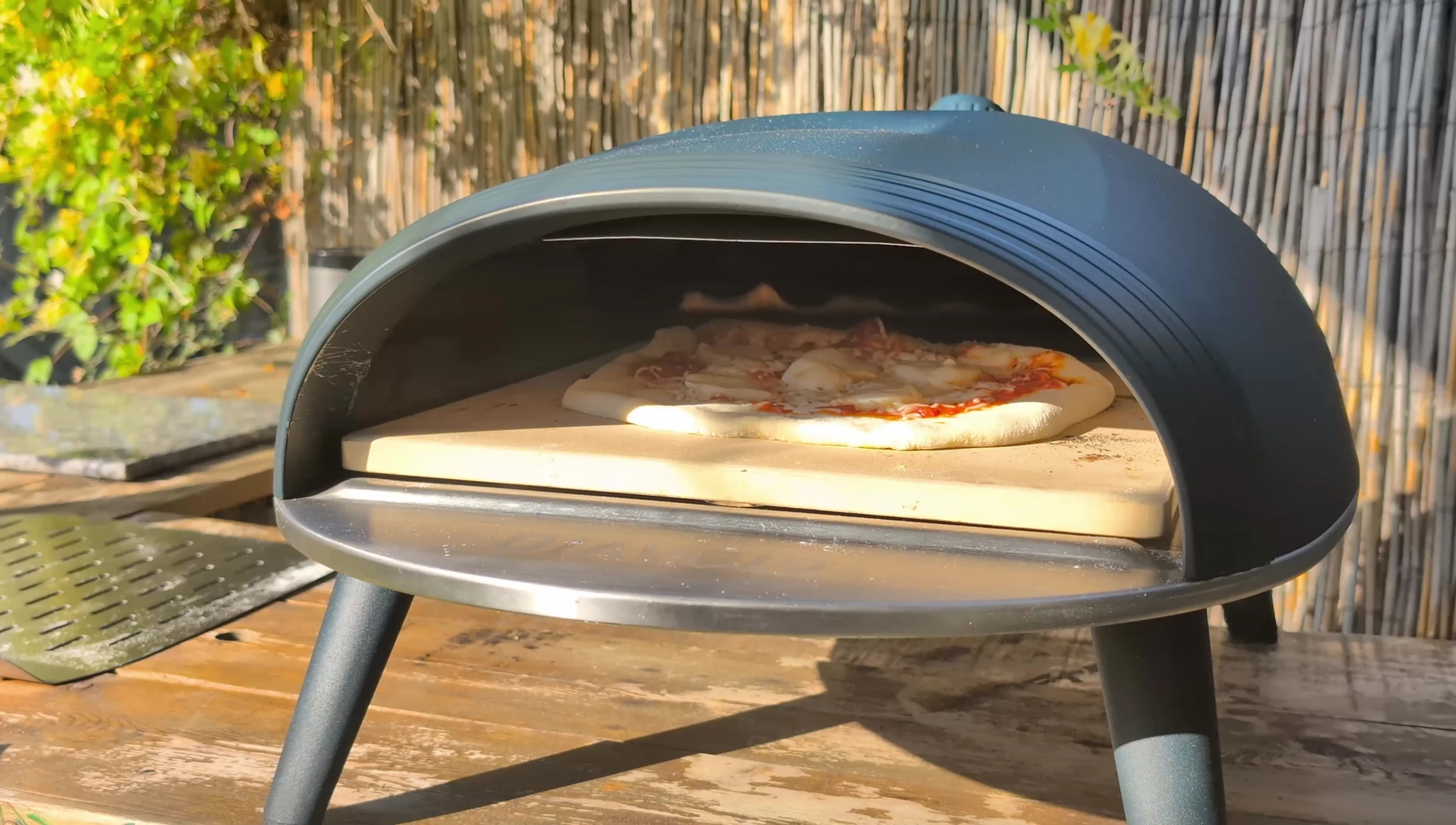 Pizza cooking in the oven, showing the puffing crust
