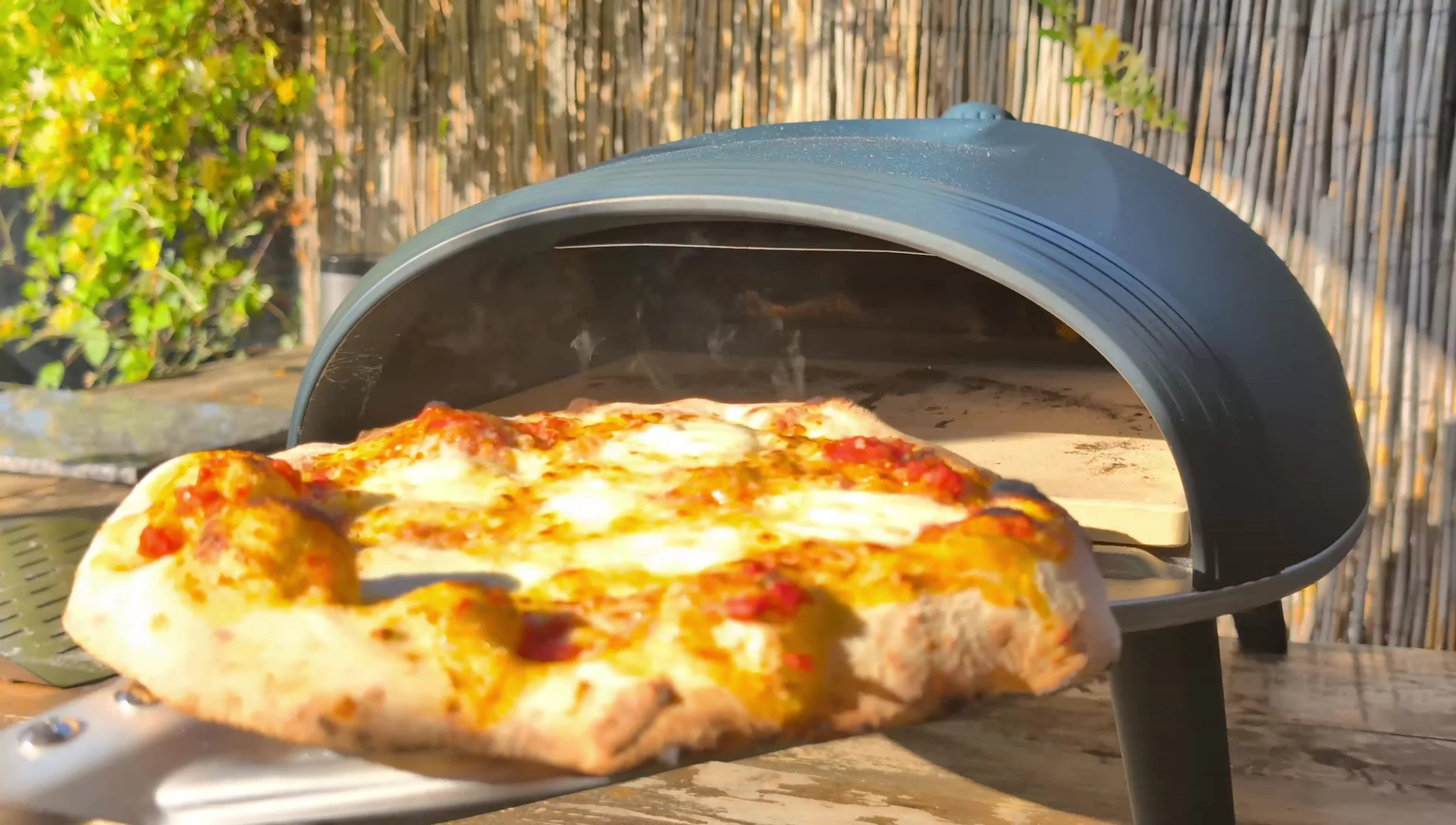 Finished pizza on a cutting board