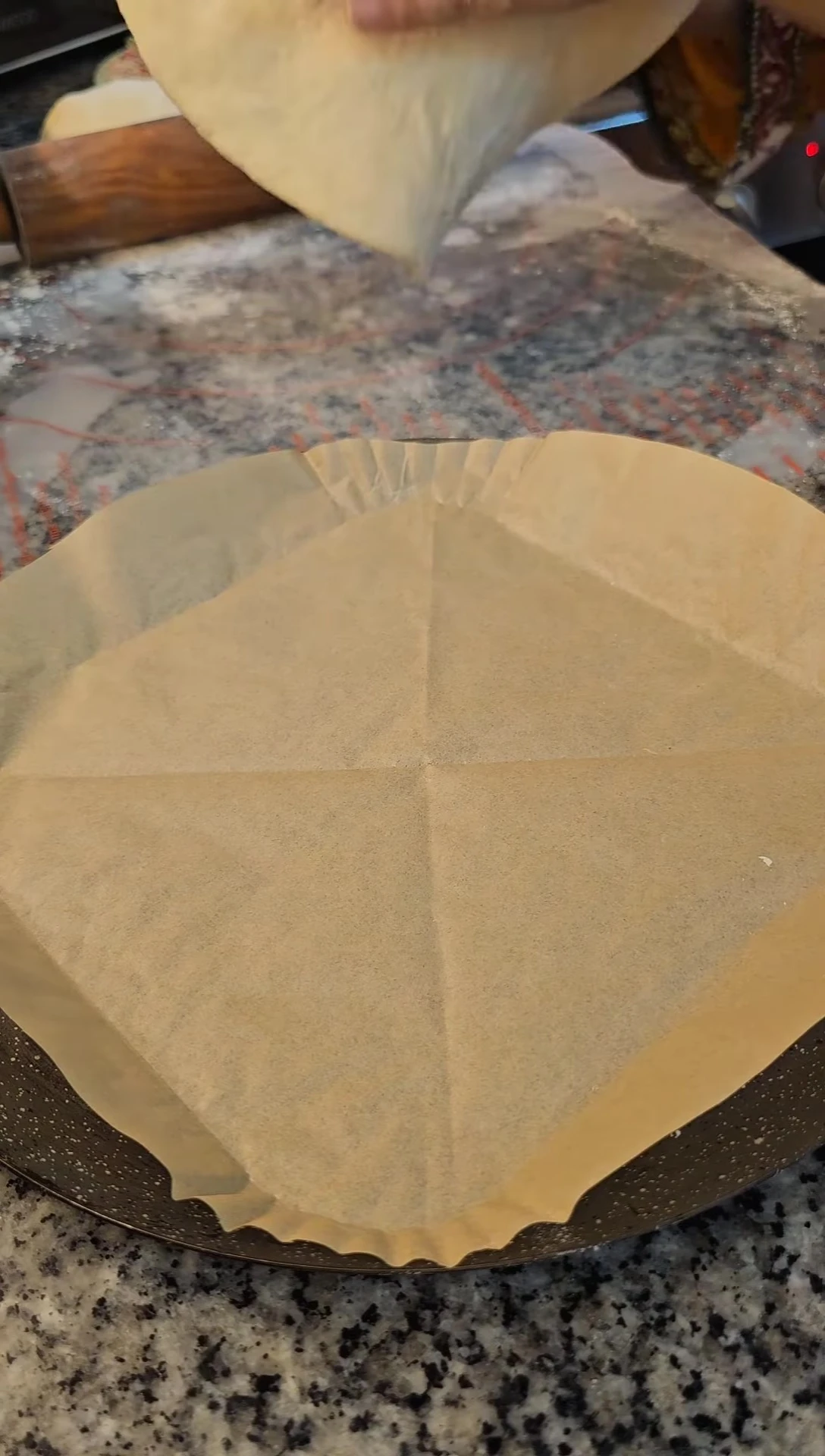 Shaping the pizza dough