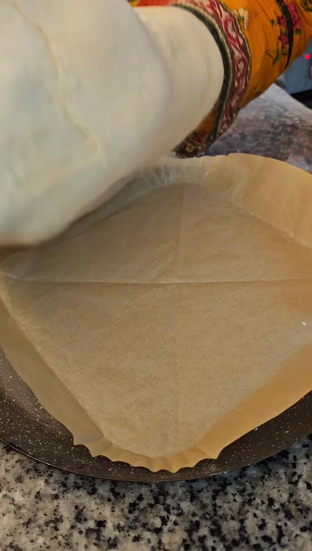 Applying the Ranch sauce to the dough