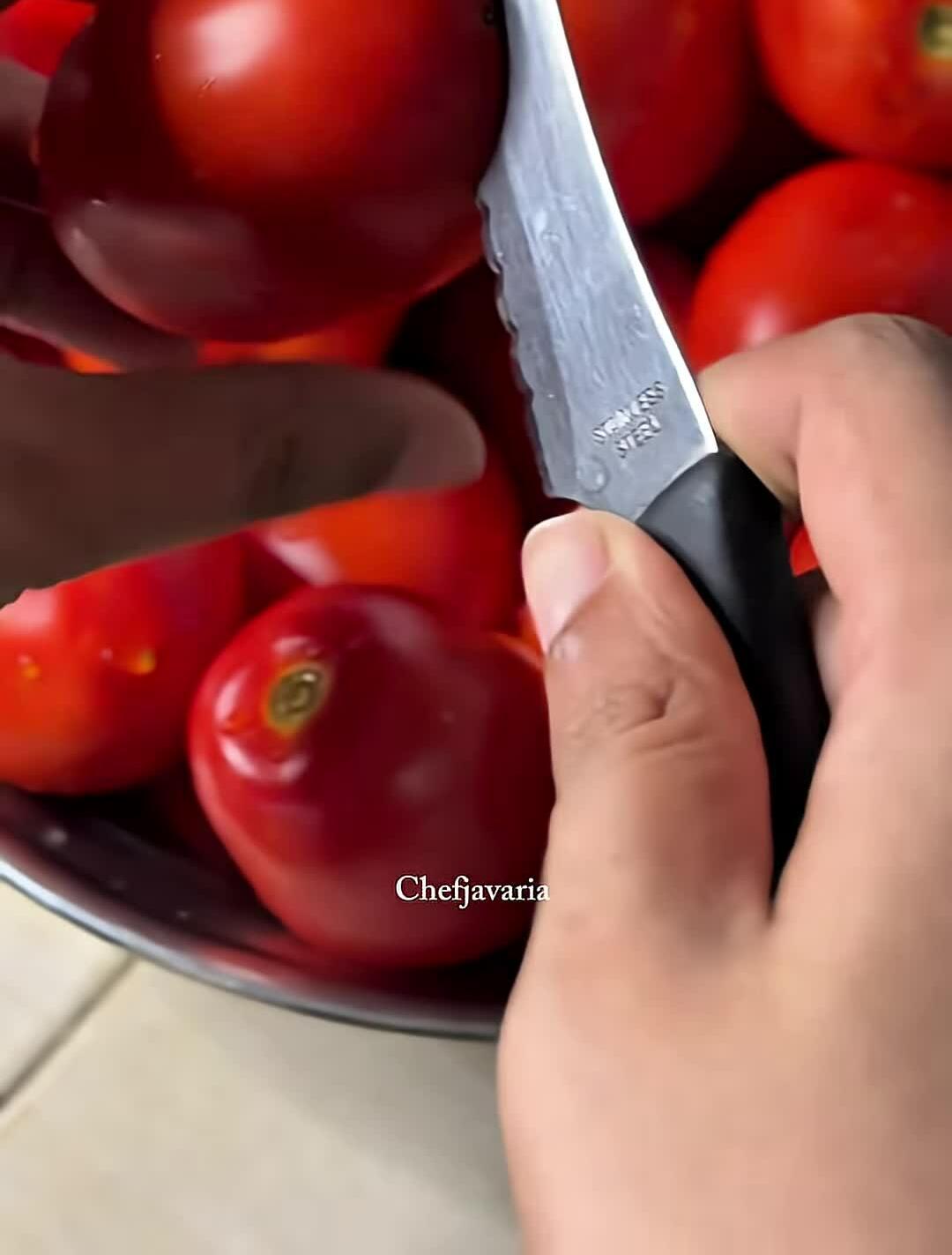 Making small cuts on the tomatoes.